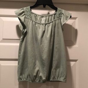 OshKosh green shirt with some flower detail at shoulders